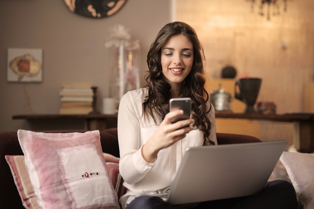 Social Media Virtual Assistant reading her post on facebook for one of the businesses she handles