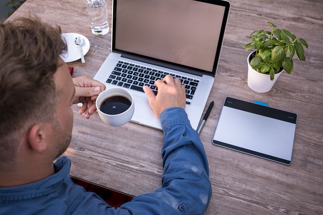 Graphic Designer staring at his laptop
